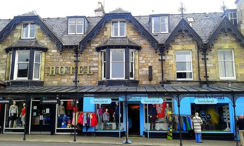 Hawkshead, Cumbria | Stone building with a hotel above and clothing shops on the ground floor.