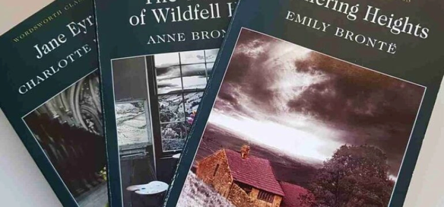 Three classic novels by the Brontë sisters: "Jane Eyre" by Charlotte Brontë, "The Tenant of Wildfell Hall" by Anne Brontë, and "Wuthering Heights" by Emily Brontë, displayed overlapping with visible cover art.