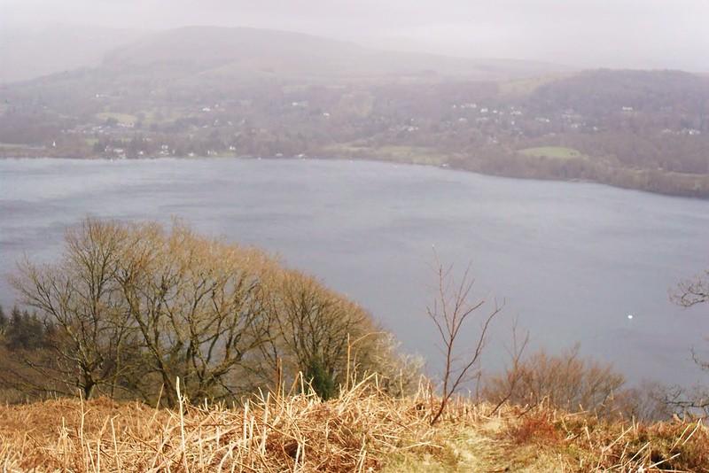 Claife Heights, Cumbria | Overlooking a large lake with barren trees and hilly terrain in the background.