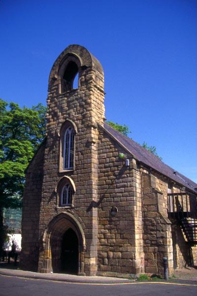 a stone church with a bell tower