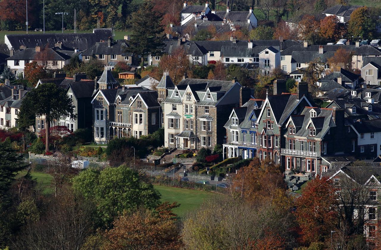 Elevated view of Victorian-style houses and cottages in Keswick, surrounded by autumn trees.